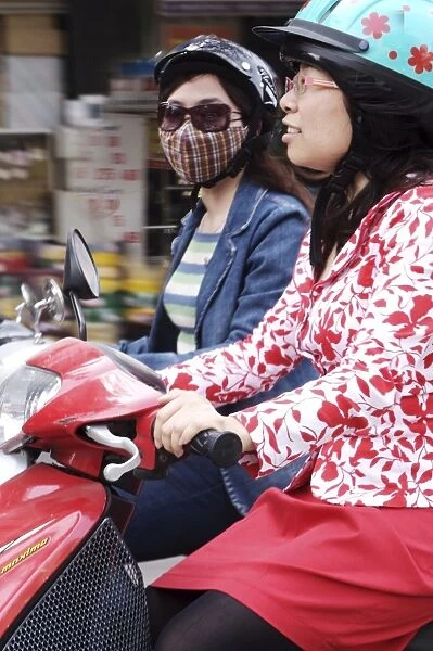 Girls on scooters, Hanoi, Vietnam, Indochina, Southeast Asia, Asia