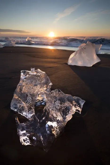 Framed Print : Glassy pieces of ice on volcanic black sand beach at sunrise, near Jokulsarlon Lagoon Framed Print : Glassy pieces of ice on volcanic black sand beach at sunrise, near Jokulsarlon Lagoon