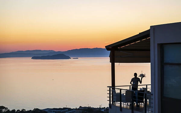 Gloomy sunset and waiter, Akrotiri, Crete, Greek Islands, Greece, Europe
