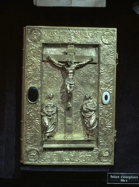 Gold book binding dating from the 16th century showing Christian scene of crucifixion