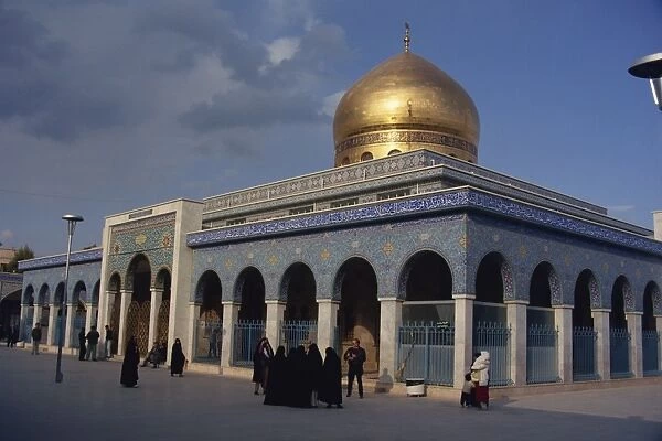 The gold dome and blue tilework of the Zanab Mosque
