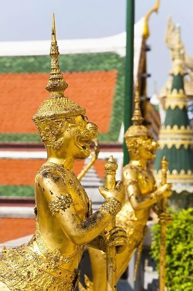 Two gold guardian statues, at the Grand Palace, Bangkok, Thailand, Southeast Asia, Asia