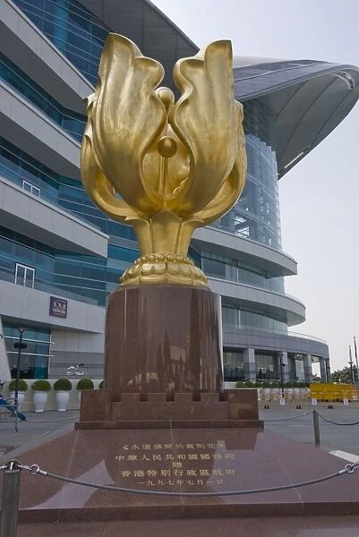 Golden bauhinia flower monument, a gift from the Peoples Republic of China to celebrate the handover from British to Chinese rule in 1997, and Convention and Exhibition Centre, Golden Bauhinia Square, Wanchai, Hong Kong