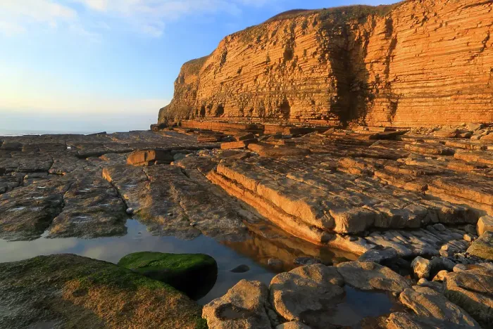 Framed Print : Golden evening light on the cliffs in winter at Dunraven Bay, Southerndown, Bridgend, South Wales, United Kingdom Framed Print : Golden evening light on the cliffs in winter at Dunraven Bay, Southerndown, Bridgend, South Wales, United Kingdom