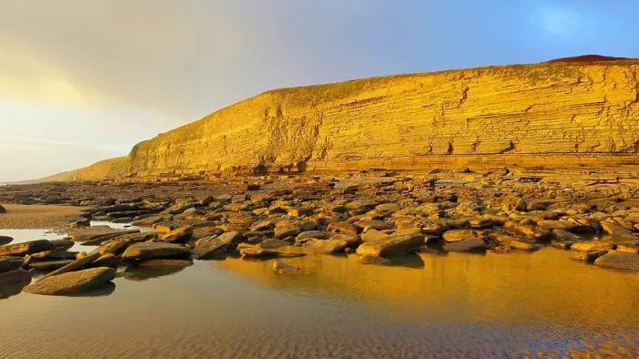 Framed Print : Golden evening light on the cliffs in winter at Dunraven Bay, Southerndown, Bridgend, South Wales, United Kingdom Framed Print : Golden evening light on the cliffs in winter at Dunraven Bay, Southerndown, Bridgend, South Wales, United Kingdom