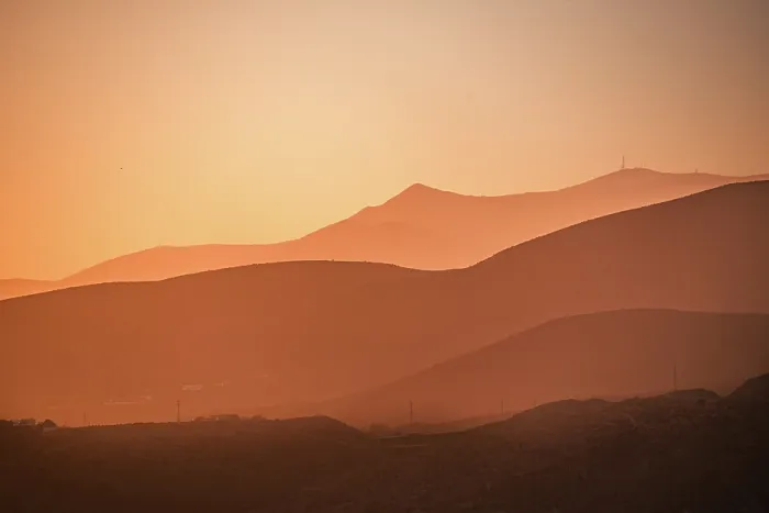 Framed Print : Golden hues blanket the rolling mountains of AlmerAa, Spain, as the setting sun creates a dreamy, layered silhouette effect Framed Print : Golden hues blanket the rolling mountains of AlmerAa, Spain, as the setting sun creates a dreamy, layered silhouette effect