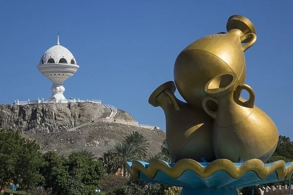 Golden sculpture on road roundabout & Incense burner (Riyam monument), Muscat, Oman