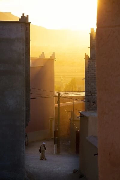 Golden sunlight shining through the streets just before sunset in the town of Nkob, near the Jbel Sarhro mountains, Morocco, North Africa, Africa