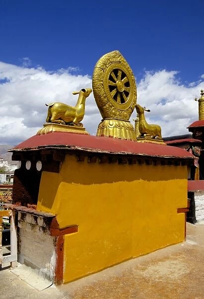 Golden Wheel of Dharma and deer sculptures on the sacred Jokhang Temple roof, Barkhor Square, Lhasa, Tibet, China, Asia