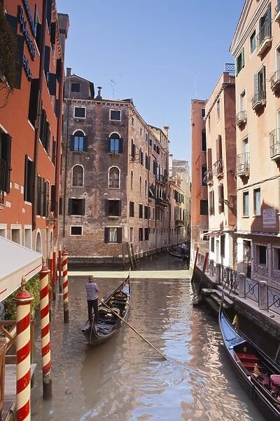 A gondola on a canal in Venice, UNESCO World Heritage Site, Veneto, Italy, Europe