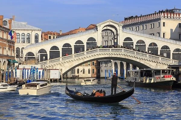 Gondola on Grand Canal and Rialto Bridge in winter, Venice, UNESCO World Heritage Site