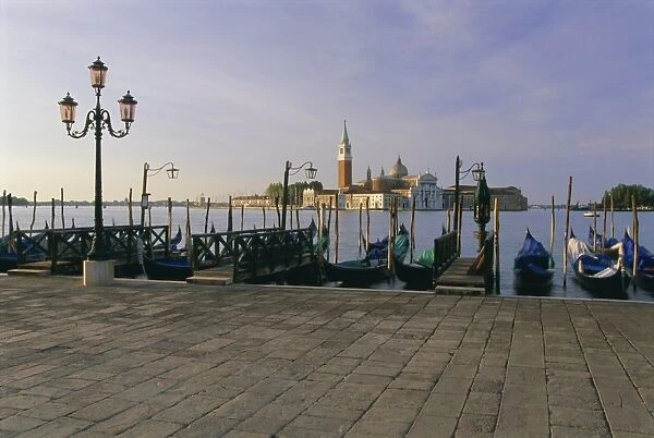 Gondolas moored with the island of San Giorgio Maggiore beyond