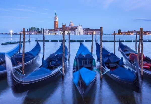 Gondolas moored at night in the Bacino di San Marco (St. Marks Basin), waterfront