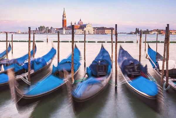 Gondolas moored at sunset in the Bacino di San Marco (St. Marks Basin), waterfront