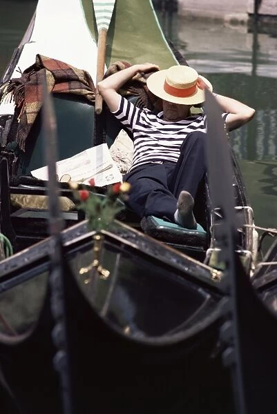 Gondolier relaxing in gondola