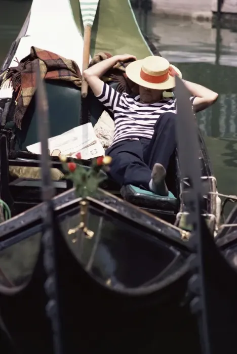 Framed Print : Gondolier relaxing in gondola Framed Print : Gondolier relaxing in gondola