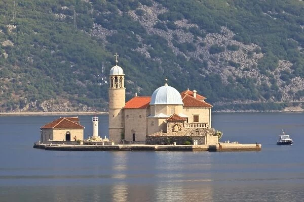 Gospa od Skrpjela (Our Lady of the Rocks) island, lit by early morning light, near Perast, Bay of Kotor, Montenegro