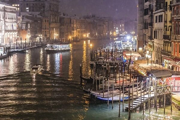 Grand Canal from Rialto Bridge during rare snowfall on a winter evening, Venice