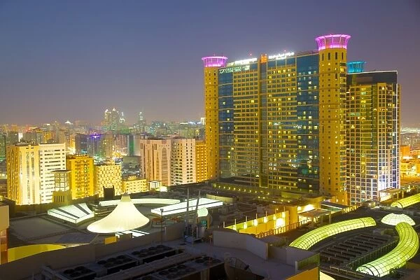 Grand Millennium Hotel and Al Wahda Mall at dusk, Abu Dhabi, United Arab Emirates, Middle East