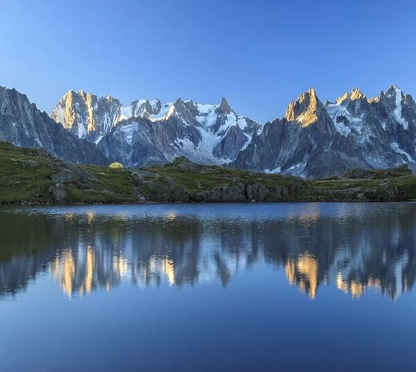 Grandes Jorasses and Dent du Geant reflected at sunrise in Lac des Cheserys, Haute Savoie