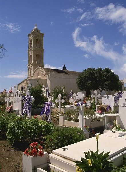 Graves decorated for Easter in front of church at Kiti, Cyprus, Europe