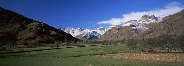 Great Langdale, view across fields to valley head and Langdale Pikes in winter