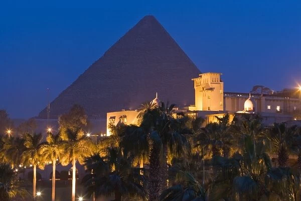 The Great Pyramid, UNESCO World Heritage Site, and the Mena House Hotel in Giza at night, near Cairo, Egypt, North Africa, Africa