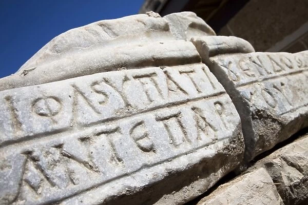 Greek inscription in a broken stone in Caesaria, Israel, Middle East