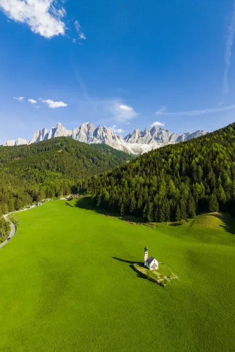 Framed Print : Green forest and meadows surrounding the small Ranui church and Odle in spring, aerial view, Funes Valley, Dolomites, South Tyrol, Italy, Europe Framed Print : Green forest and meadows surrounding the small Ranui church and Odle in spring, aerial view, Funes Valley, Dolomites, South Tyrol, Italy, Europe
