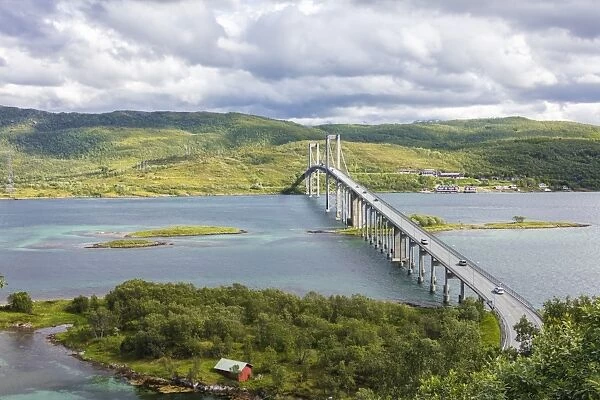 Green hills and turquoise sea frame the suspension road bridge in Tjeldsundbrua, Troms county