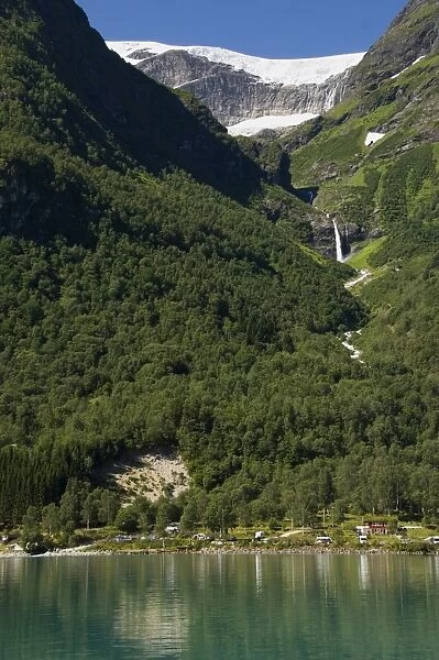 Green lake, waterfall, and glacier above Olden, Fjordland, Norway, Scandinavia, Europe