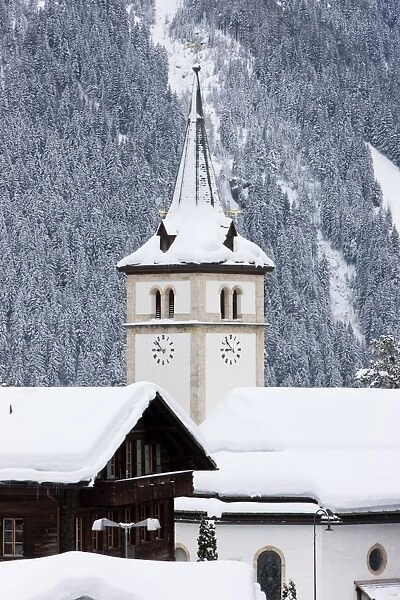 Grindelwald village church after a heavy fall of snow, Jungfrau region
