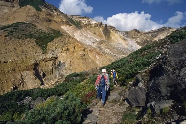 A group of hikers on a path in the Daisetsuzan Range