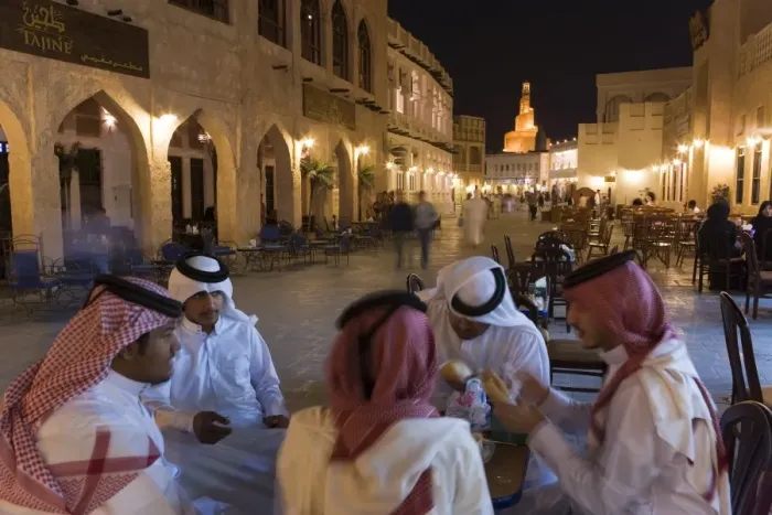 Framed Print : A group of men in Arabian dress in the restored Souq Waqif Framed Print : A group of men in Arabian dress in the restored Souq Waqif
