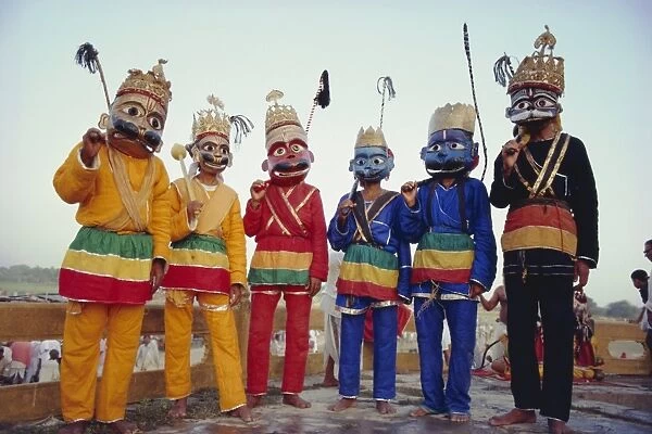 Group portrait of masked actors in the Ramlilla