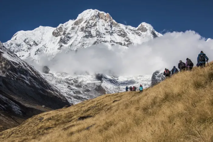 Framed Print : A group of Trekkers approaching Annapurna Base Camp, with Annapurna South looming Framed Print : A group of Trekkers approaching Annapurna Base Camp, with Annapurna South looming