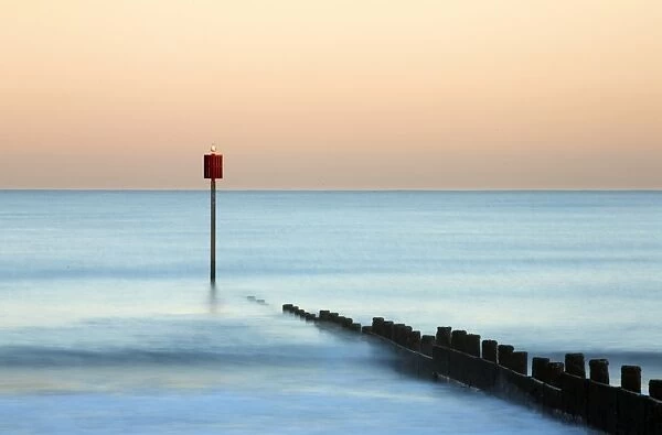 Groyne and post at sunset on Blyth Beach, Blyth, Northumberland, England, United Kingdom