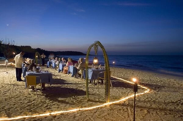 Guests dining at dusk on the Playa Esmeralda in front of the Hotel Melia Rio de Oro