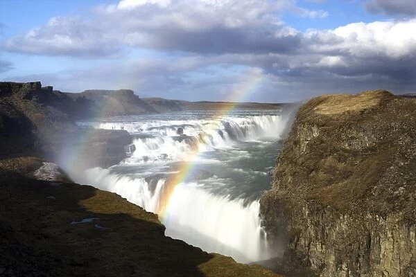 Gullfoss, Europes biggest waterfall, with rainbow created by spray from the falls