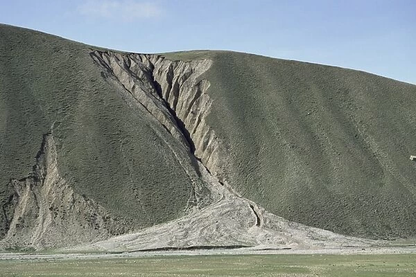 Gully erosion and alluvial fan on hillside 500m high, Nyainqentangla Mountains