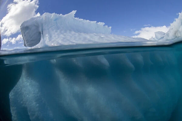 Half above and half below photo of an iceberg off Danco Island, Antarctica, Polar Regions