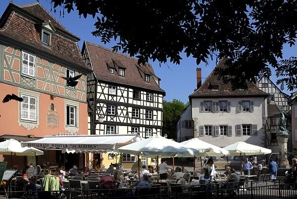 Half timbered and painted buildings and restaurants