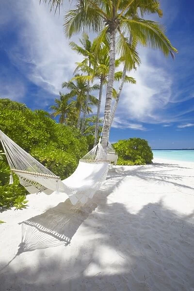 Hammock on empty tropical beach, Maldives, Indian Ocean, Asia