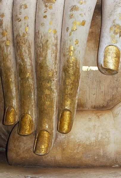 Detail of the hand of a stucco seated Buddha statue