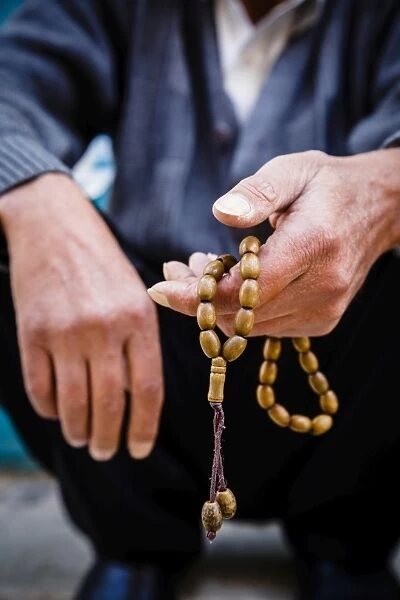 Hands holding worry beads, Bethlehem, West Bank, Palestine territories, Israel, Middle
