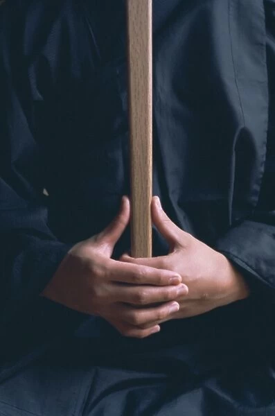 Hands of monk in the posture kyoskku (awakening spirit)