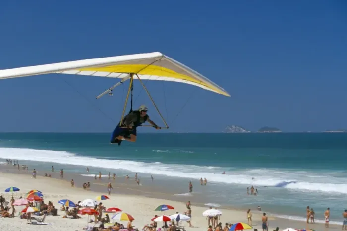 Framed Print : Hang-glider landing on Pepino beach, Rio de Janeiro, Brazil, South America Framed Print : Hang-glider landing on Pepino beach, Rio de Janeiro, Brazil, South America