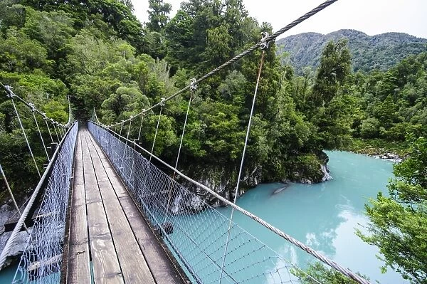 Hanging bridge above the turquoise water in the Hokitika Gorge, West Coast, South Island, New Zealand, Pacific