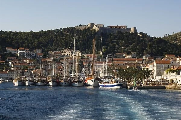Harbour area and Venetian fortress dating from 1551 on the hill, Hvar Island