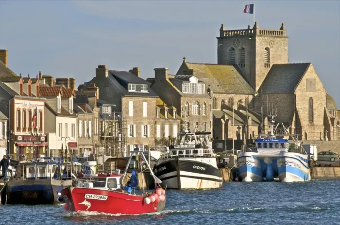 Framed Print : Harbour and fishing boats with houses and church in the background, Barfleur Framed Print : Harbour and fishing boats with houses and church in the background, Barfleur